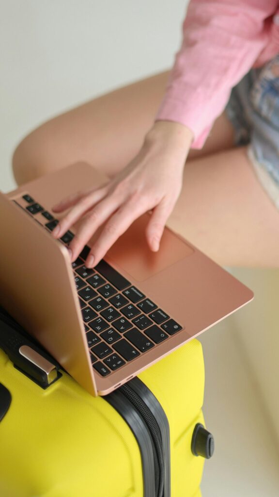 Aesthetic Rose Gold Laptop and Travel Suitcase Mobile Wallpaper