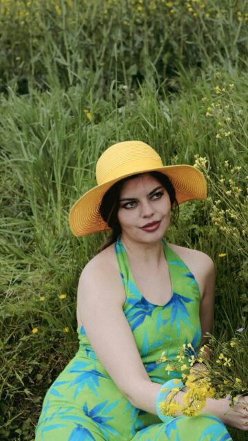 Woman in Green Tropical Dress and Yellow Sun Hat Summer Portrait Wallpaper