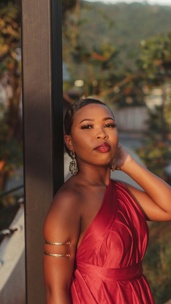 Elegant Black Woman in Red Evening Gown Portrait Mobile Wallpaper