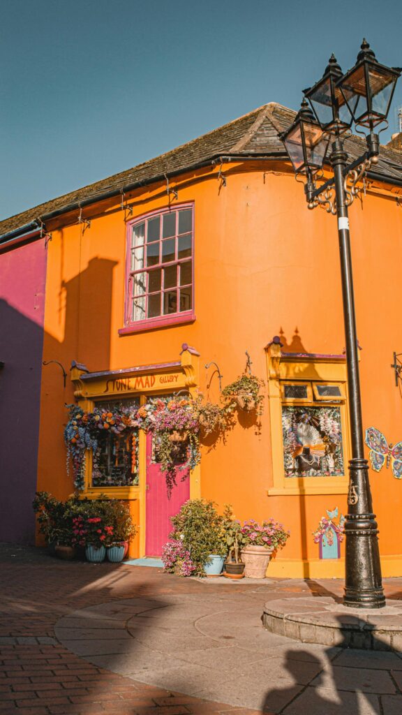 Vibrant Orange Stone Mad Gallery Shop Exterior Mobile Wallpaper