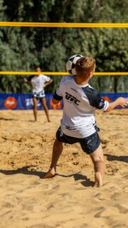 Professional Beach Volleyball Player Action Shot Mobile Wallpaper