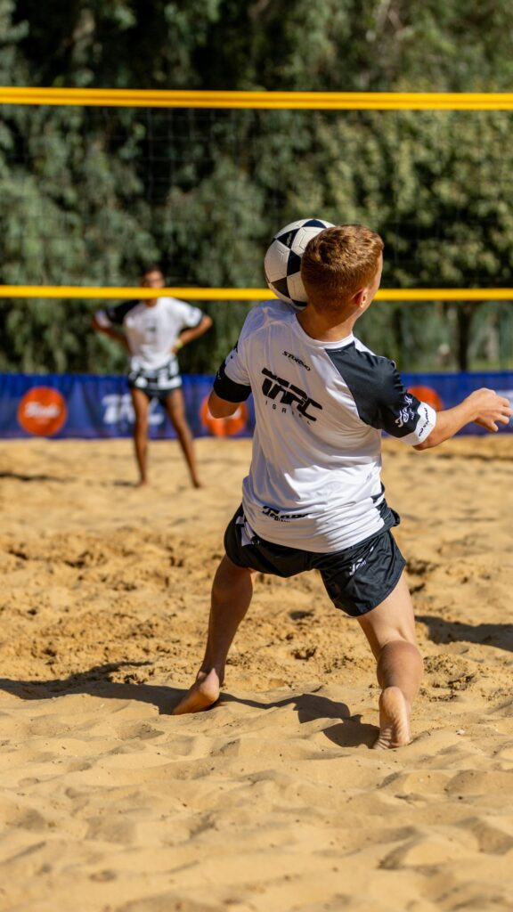 Professional Beach Volleyball Player Action Shot Mobile Wallpaper