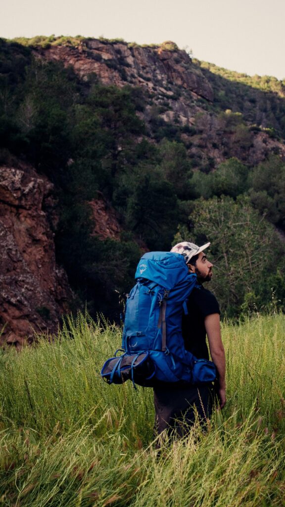 Adventurous Hiker in Mountain Nature Wilderness Mobile Wallpaper