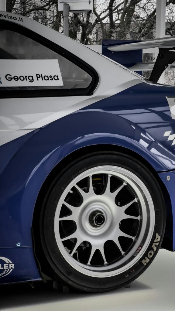 Georg Plasa BMW Race Car Rear Wheel Close-Up Phone Wallpaper
