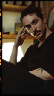 Moody Portrait of a Stylish Man with Mustache and Ring Wallpaper
