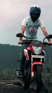 Biker Riding Red Honda Sports Motorcycle Outdoors 4K Phone Wallpaper