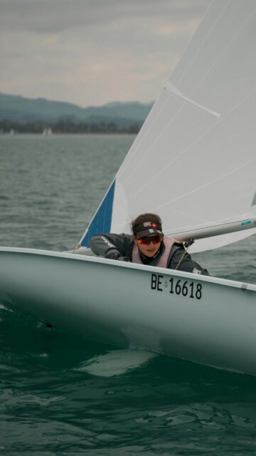 Sailor in Action on Open Water High Resolution Mobile Wallpaper