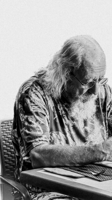 Elderly Man in Thought Portrait Black and White Mobile Wallpaper