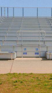 Empty Stadium Bleachers with Accessible Seating Mobile Wallpaper