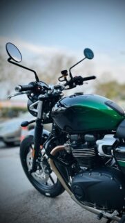 Green Triumph Motorcycle Close-up Aesthetic Phone Wallpaper