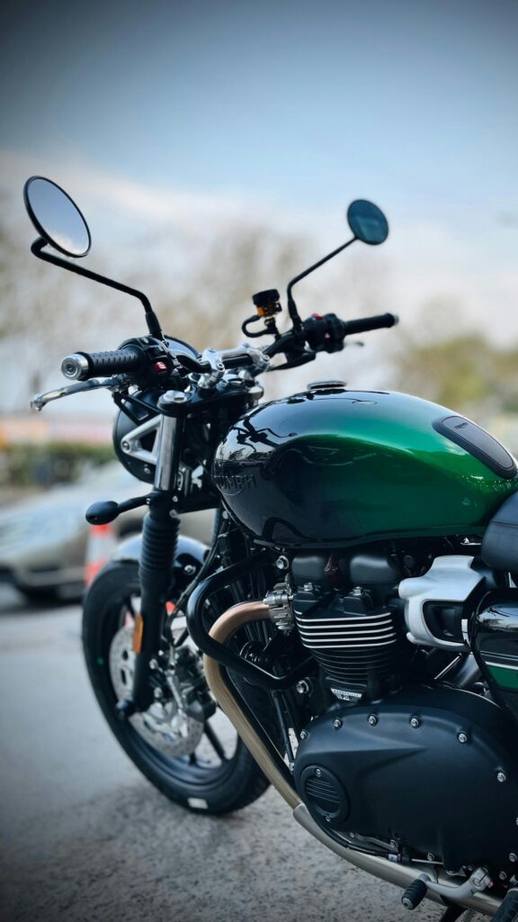 Green Triumph Motorcycle Close-up Aesthetic Phone Wallpaper
