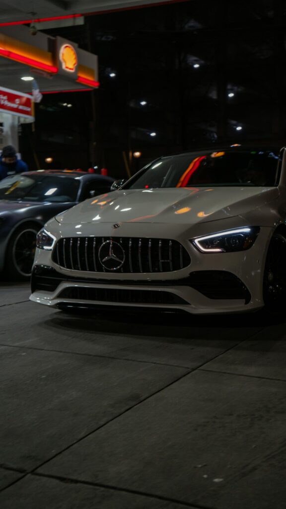 Stunning White Mercedes-AMG GT 4-Door Coupe at Gas Station Wallpaper