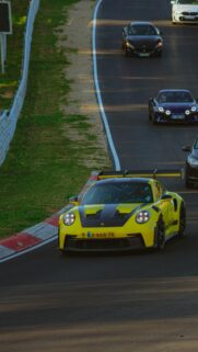 Yellow Porsche 911 GT3 RS Racing on Nurburgring Track Wallpaper