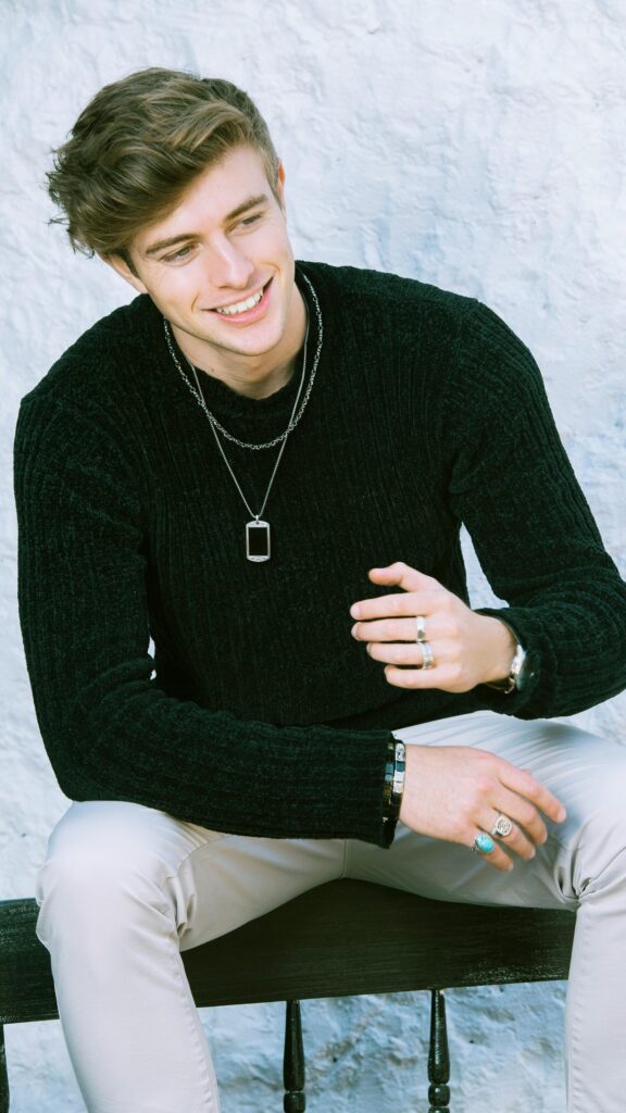 Stylish Young Man in Black Sweater Portrait Mobile Wallpaper
