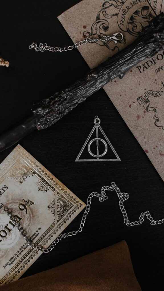 Magical Wizard Wand and Deathly Hallows Relics Phone Wallpaper