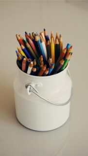 Colorful Colored Pencils in Vintage White Metal Container Wallpaper