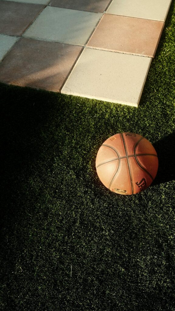 Basketball on Grass and Tiles Minimalist Sports Mobile Wallpaper