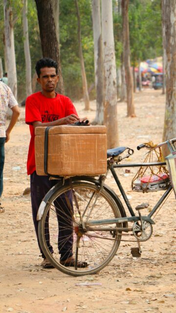 Street Vendor With Bicycle Cooler Professional Photography Mobile Wallpaper