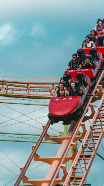 Exciting Roller Coaster Ride with Friends Mobile Wallpaper