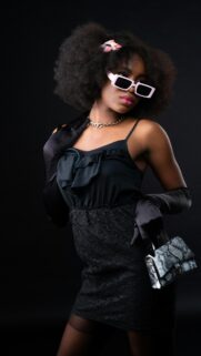 Chic Fashionista With Afro and Pink Sunglasses Mobile Wallpaper