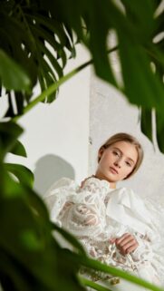 Elegant Woman in Lace White Blouse Nature Portrait Phone Wallpaper