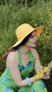 Woman in Green Floral Dress with Yellow Sun Hat Nature Wallpaper