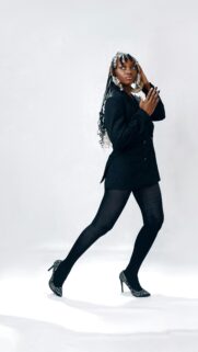 Elegant Black Blazer Fashion Model Posing in Studio Mobile Wallpaper