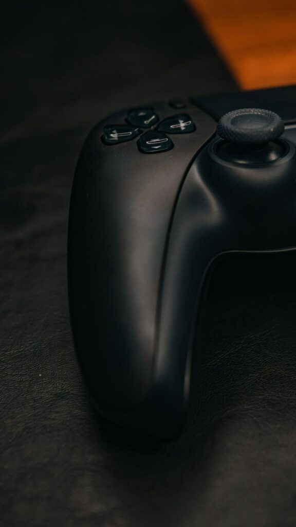 Sleek Black PS5 Controller Close-Up Gaming Aesthetic Wallpaper