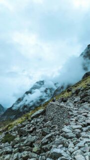 Rugged Mountain Trail Hiking Path in Misty Clouds Phone Wallpaper