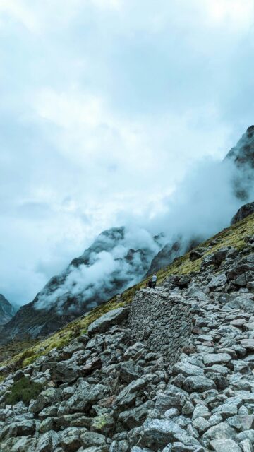 Rugged Mountain Trail Hiking Path in Misty Clouds Phone Wallpaper