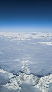 Stunning Snowy Mountain Range Above Clouds Aerial View Mobile Wallpaper