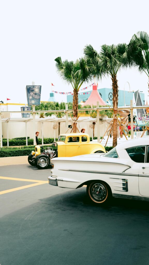 Vintage Yellow Hot Rod and Classic Car at Theme Park Wallpaper