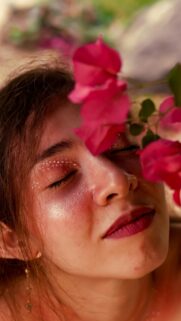 Close-up Portrait of a Woman with Pink Flowers Floral Aesthetic Wallpaper