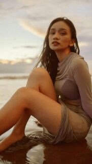 Stunning Portrait of a Woman on a Beach at Sunset Mobile Wallpaper