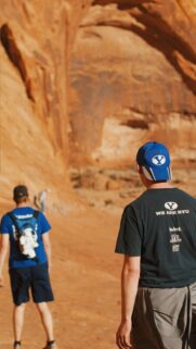 BYU Fans Hiking Through Scenic Desert Sandstone Canyon Mobile Wallpaper