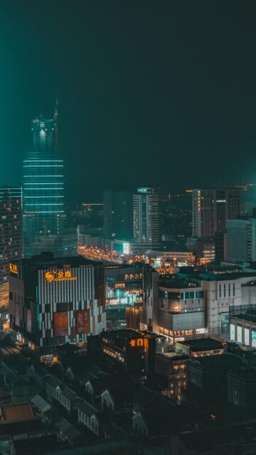 Stunning Neon Night Cityscape with Golden Eagle Skyscrapers Mobile Wallpaper
