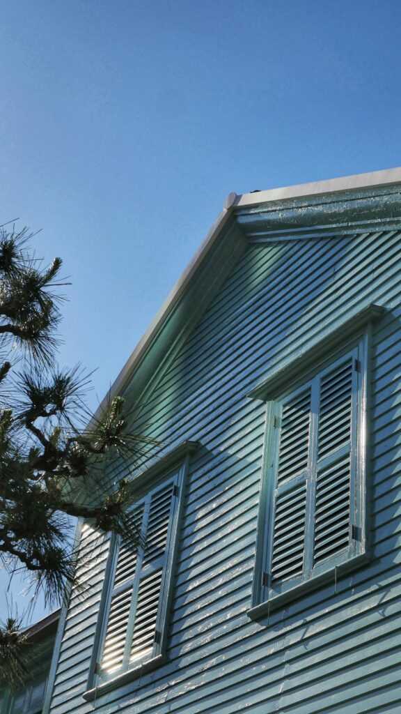 Serene Pastel Blue Wooden House Exterior Aesthetic Wallpaper