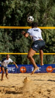 Dynamic Footvolley Spike Mid-Air Action Professional Sports Wallpaper