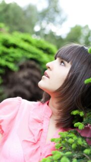 Beautiful Woman with Dark Bob Hair in Pink Blouse Outdoor Portrait Wallpaper
