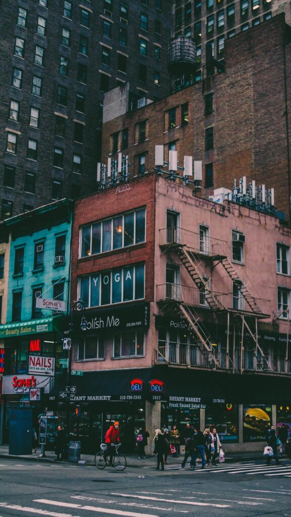 Urban NYC Streetscape with Iconic Fire Escape Architecture Wallpaper