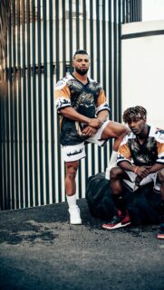 Athletic Duo in Streetwear Urban Gym Fashion Mobile Wallpaper