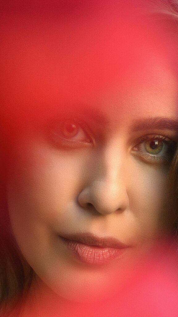 Stunning Artistic Portrait of a Woman with Piercing Green Eyes Wallpaper