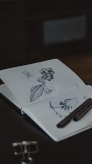 Minimalist Botanical Ink Sketch Art on Open Sketchbook Mobile Wallpaper
