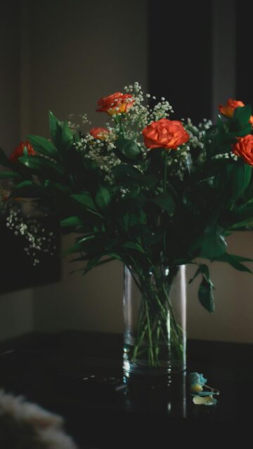 Elegant Orange Rose Bouquet in a Glass Vase Aesthetic Wallpaper