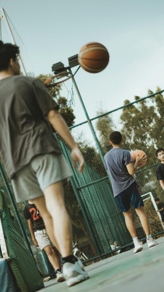 Dynamic Basketball Court Action Shot Mobile Phone Wallpaper
