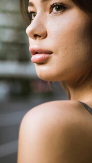 Stunning Close-up Portrait of a Beautiful Young Woman Phone Wallpaper