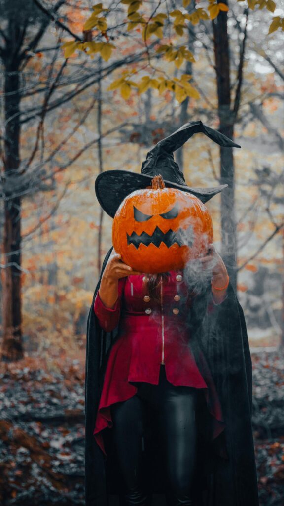 Spooky Witch with Smoking Jack-O-Lantern Halloween Mobile Wallpaper