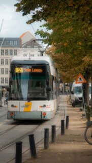 Modern Belgian Tram 2 Melle Leeuw on Urban Street Mobile Wallpaper