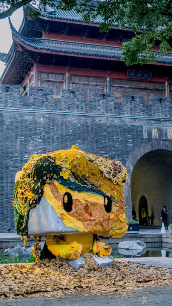 Funko Pop Style Creative Art Statue in Historic China Setting Wallpaper