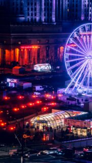 Vibrant Warsaw Night Cityscape with Ferris Wheel Phone Wallpaper